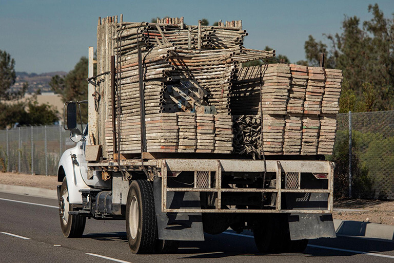 A truck transporting scaffolding materials