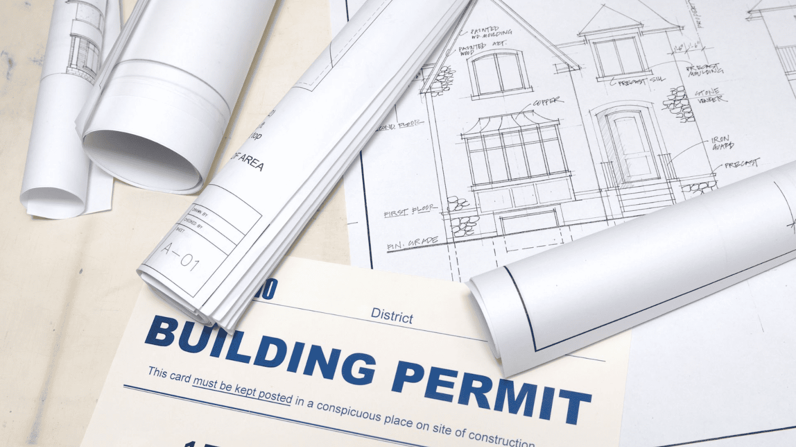 Blueprints of a residential building and a building permit.
