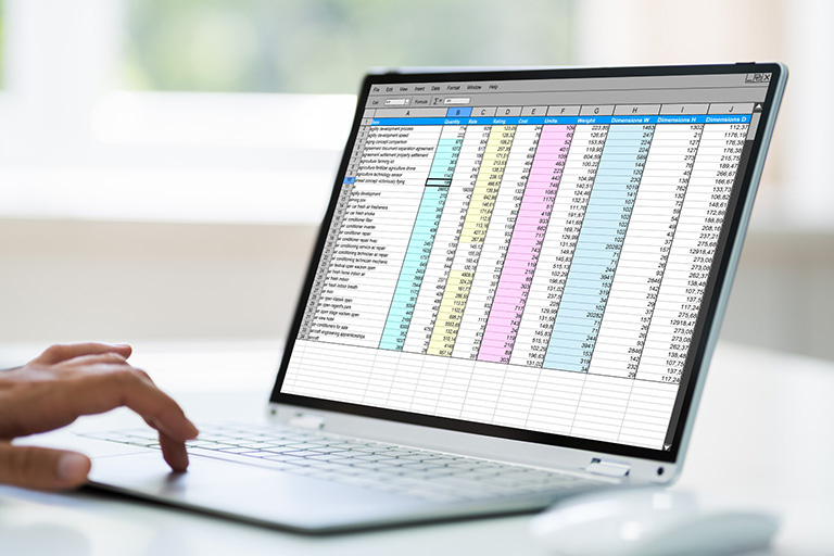 A person calculating construction costs in a digital spreadsheet