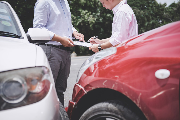 People in a vehicular collision filing auto insurance claims