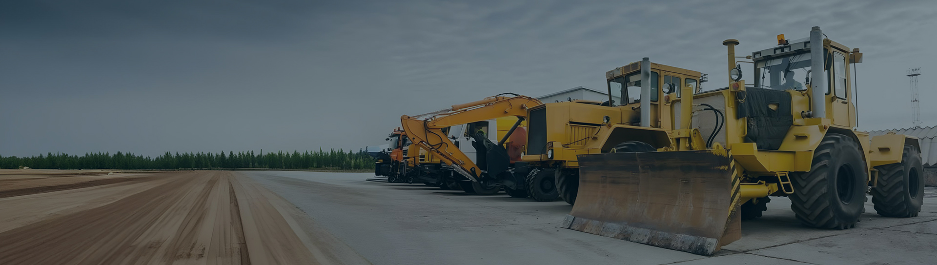 Different kinds of heavy equipment lined up