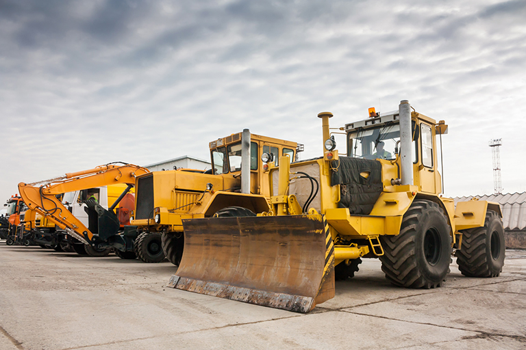 Equipment rental business lining up different construction equipment