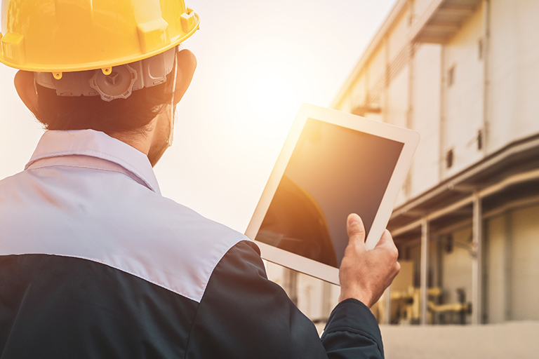 Contractor using an app on the job site