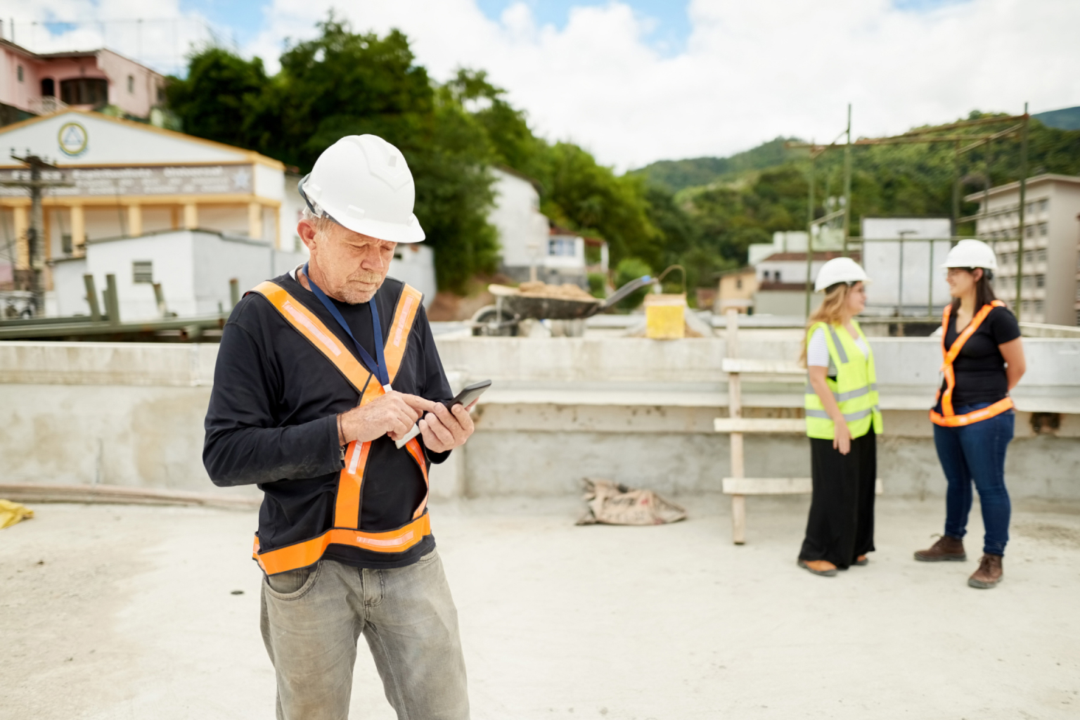 Contractor using an app on a job site