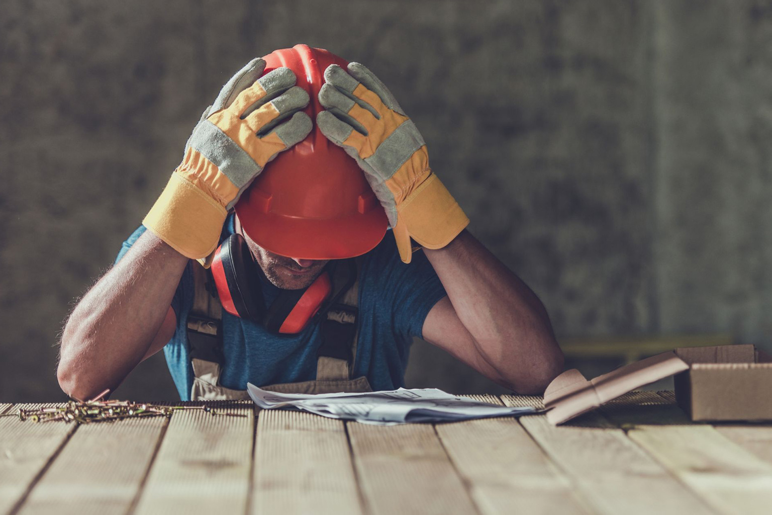 Contractor looking frustrated at his pollution insurance policy not sure if it is right